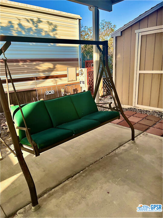 70201 Aurora Road Desert Hot Springs, CA 92241 - Photo 5 of 18 a view of swimming pool with a couch and wooden floor