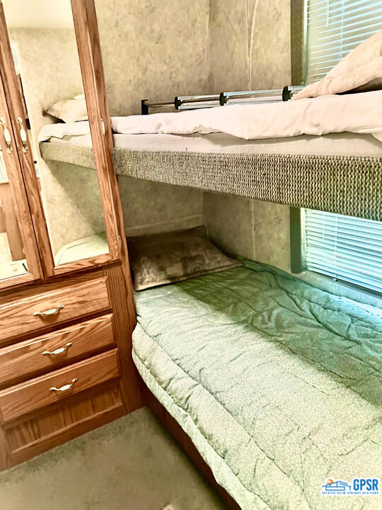 70201 Aurora Road Desert Hot Springs, CA 92241 - Photo 7 of 18 a bedroom with a bed and a window