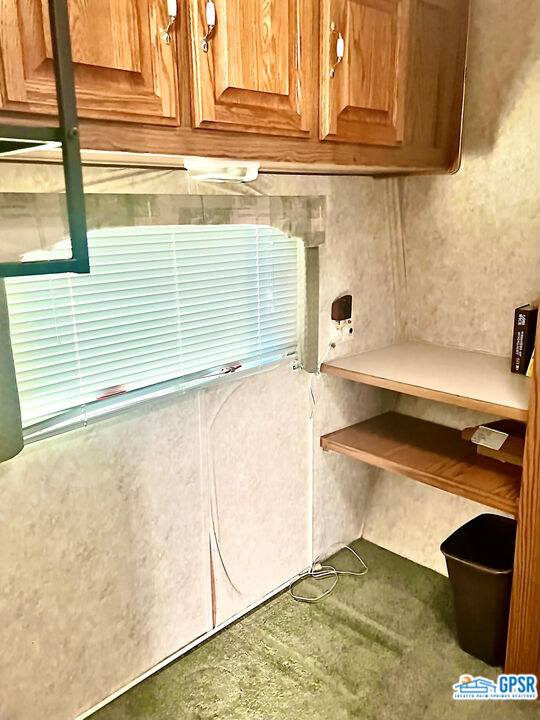 70201 Aurora Road Desert Hot Springs, CA 92241 - Photo 8 of 18 a bathroom with a sink and a washing machine