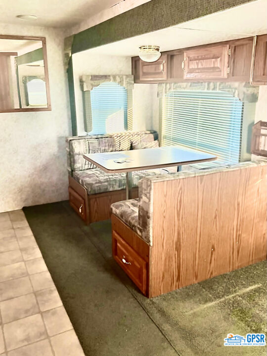 70201 Aurora Road Desert Hot Springs, CA 92241 - Photo 9 of 18 a bathroom with a sink a mirror and next to a window