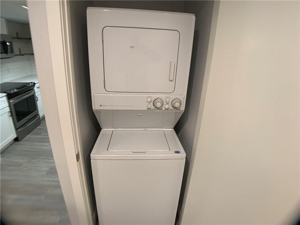 1135 Barton Hills Drive, Unit 252 Austin, TX 78704 - Photo 14 of 19 Laundry area with stacked washer / drying machine