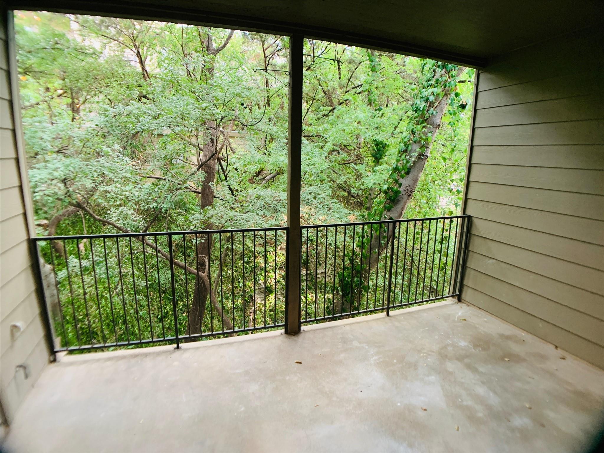1135 Barton Hills Drive, Unit 252 Austin, TX 78704 - Photo 15 of 19 Balcony with a view of trees