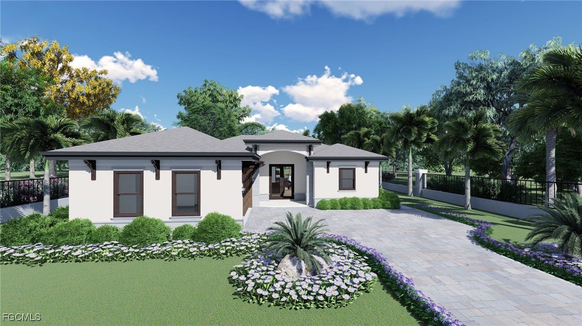 2401 East 10th Street Lehigh Acres, FL 33936 - Photo 1 of 2 a front view of a house with a garden
