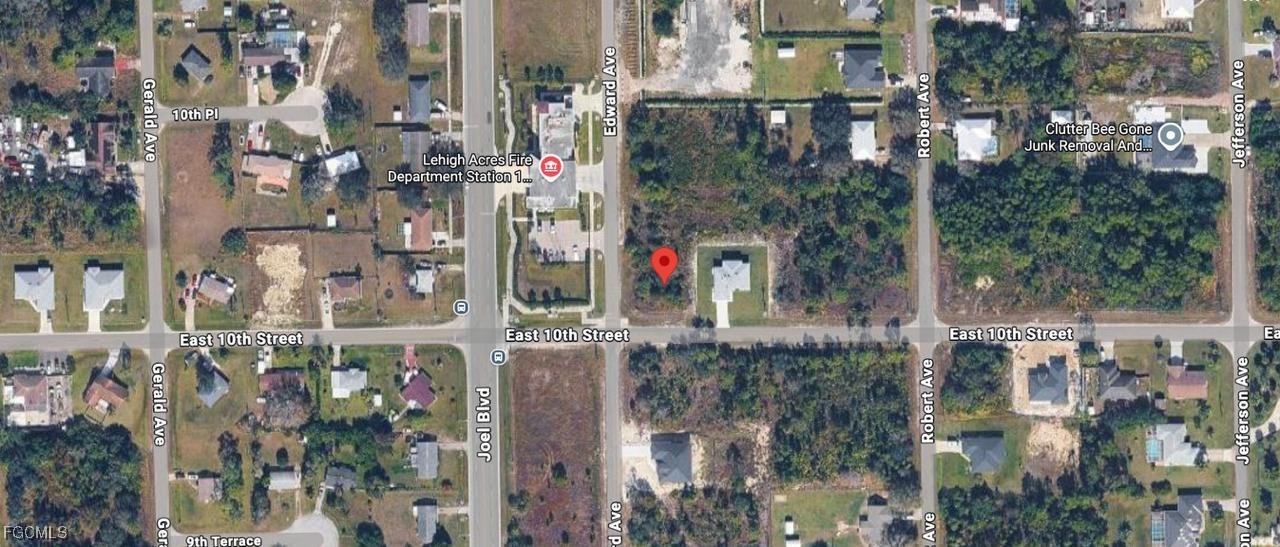 2401 East 10th Street Lehigh Acres, FL 33936 - Photo 2 of 2 a view of street and entrance to building