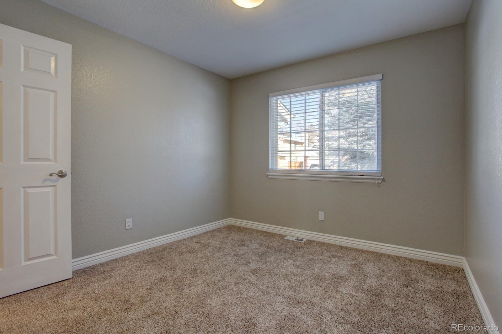 63 Prairie Ridge Road Highlands Ranch, CO 80126 - Photo 15 of 29 an empty room with a window