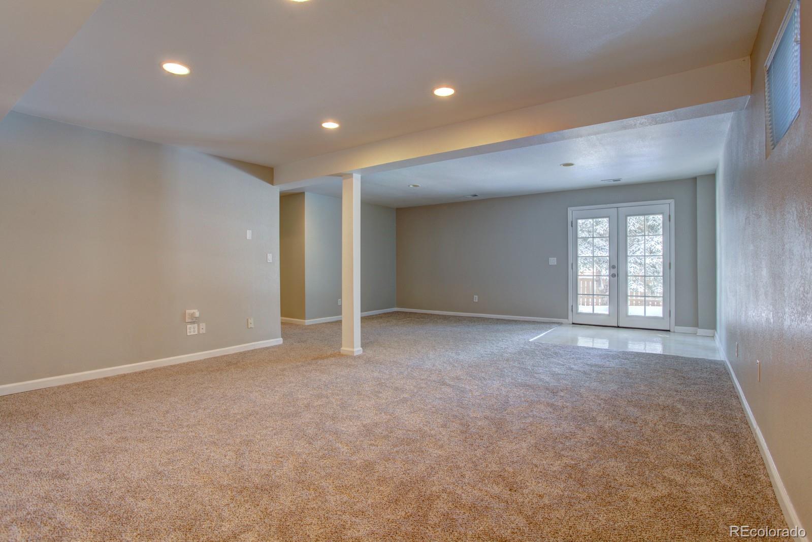 63 Prairie Ridge Road Highlands Ranch, CO 80126 - Photo 17 of 29 a view of an empty room with windows