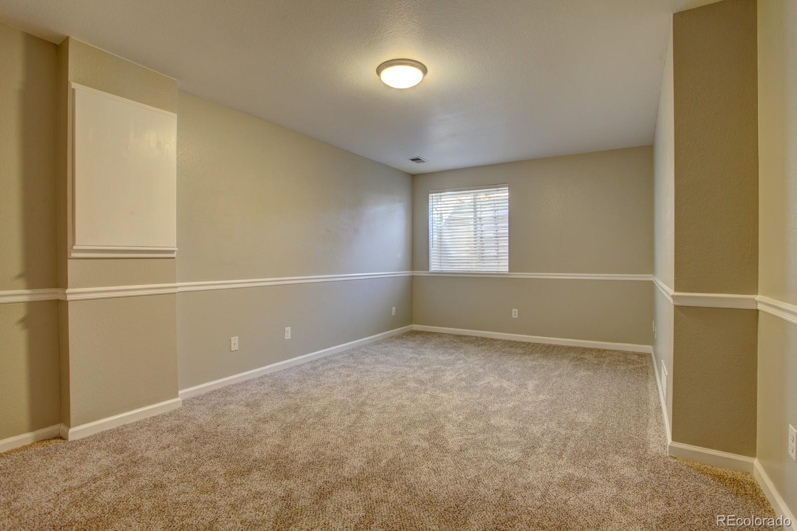 63 Prairie Ridge Road Highlands Ranch, CO 80126 - Photo 22 of 29 an empty room with windows