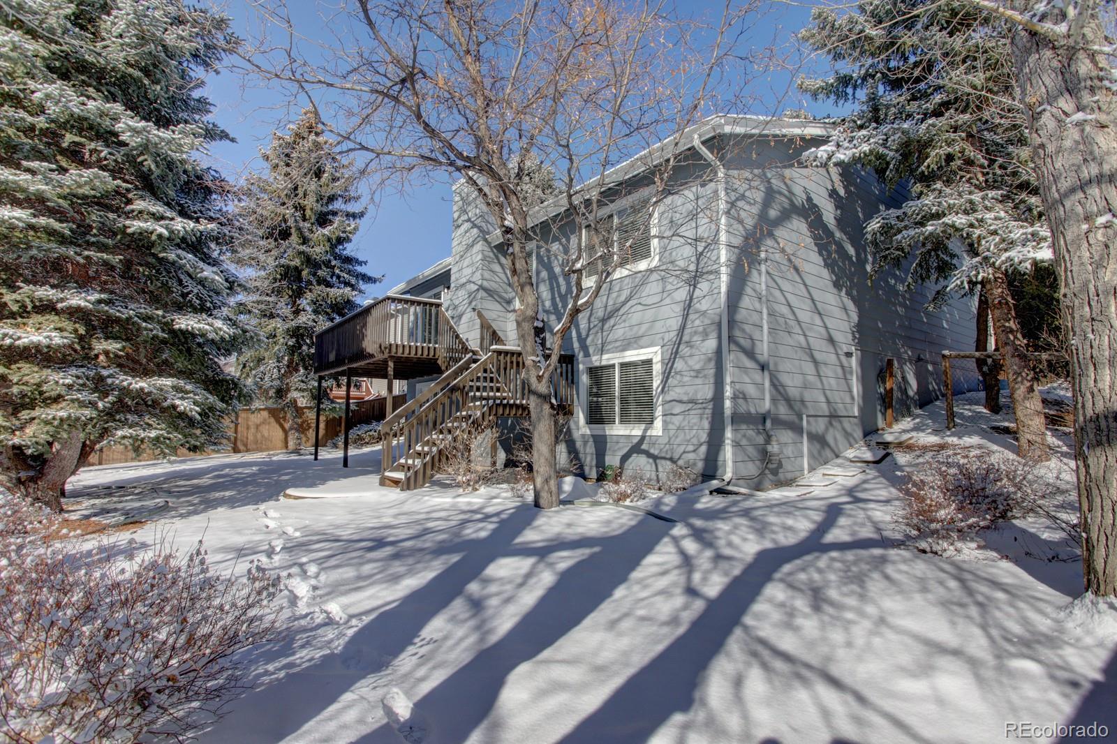 63 Prairie Ridge Road Highlands Ranch, CO 80126 - Photo 26 of 29 a view of a house with a snow in the yard