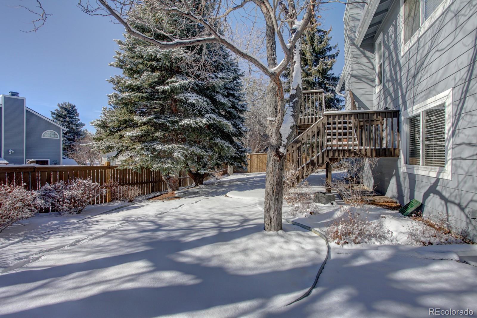 63 Prairie Ridge Road Highlands Ranch, CO 80126 - Photo 27 of 29 a view of a yard with plants and trees