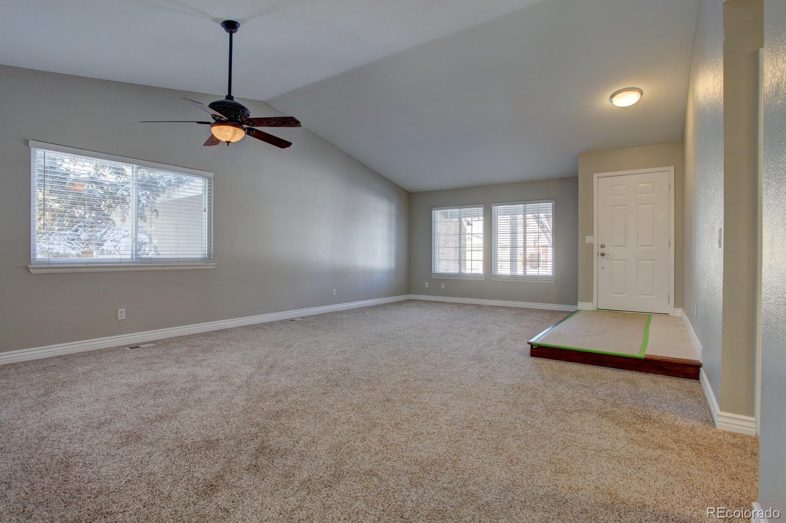 63 Prairie Ridge Road Highlands Ranch, CO 80126 - Photo 3 of 29 a view of empty room with windows