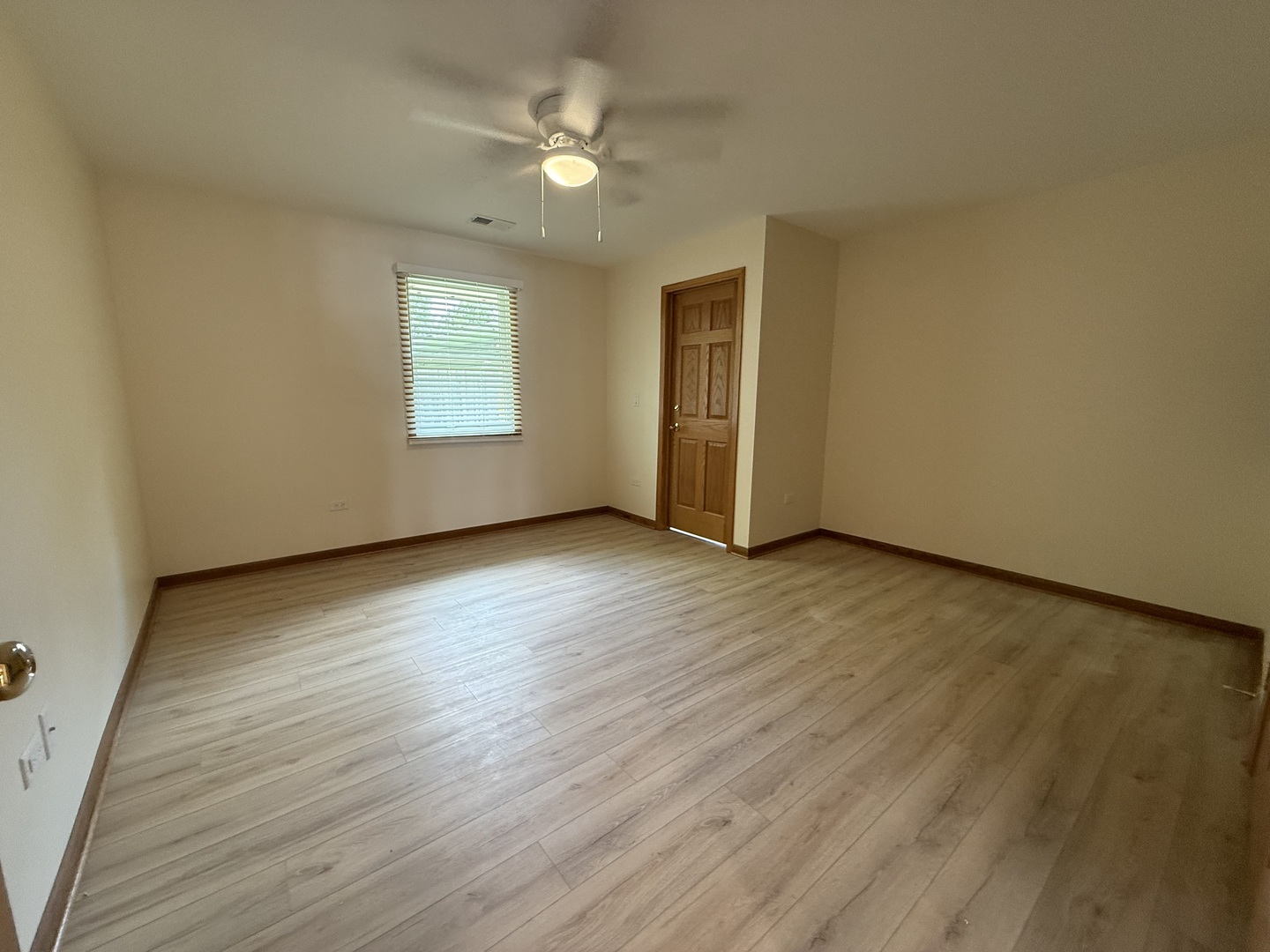 532 West Street, Unit 6 Lockport, IL 60441 - Photo 13 of 13 a view of an empty room with wooden floor and a window