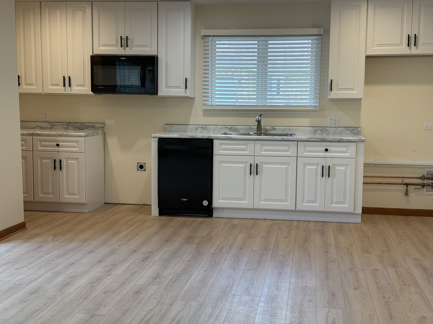 532 West Street, Unit 6 Lockport, IL 60441 - Photo 6 of 13 a kitchen with stainless steel appliances granite countertop a stove a sink and a microwave