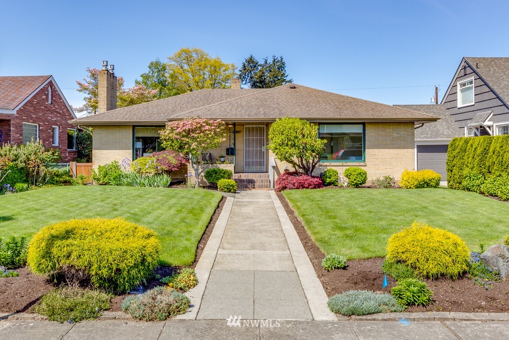 822 Rucker Avenue Everett, WA 98201 - Photo 1 of 40 a front view of a house with garden