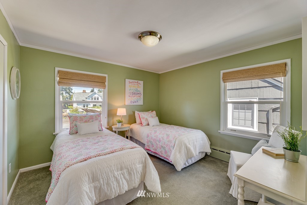 822 Rucker Avenue Everett, WA 98201 - Photo 18 of 40 a bedroom with two beds and a potted plant