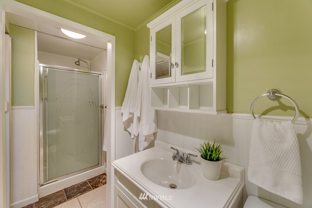822 Rucker Avenue Everett, WA 98201 - Photo 21 of 40 a bathroom with a sink and a mirror