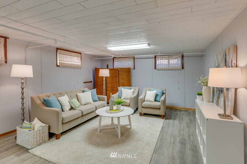 822 Rucker Avenue Everett, WA 98201 - Photo 22 of 40 a living room with furniture and a lamp on table with wooden floor