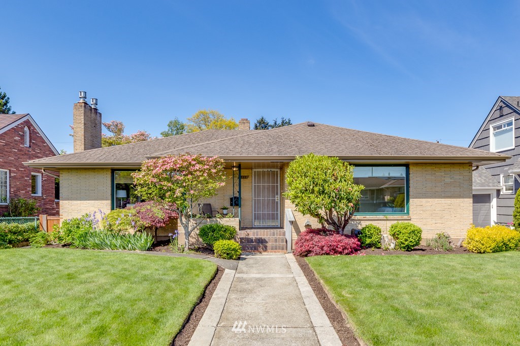 822 Rucker Avenue Everett, WA 98201 - Photo 40 of 40 a front view of a house with a yard and garage