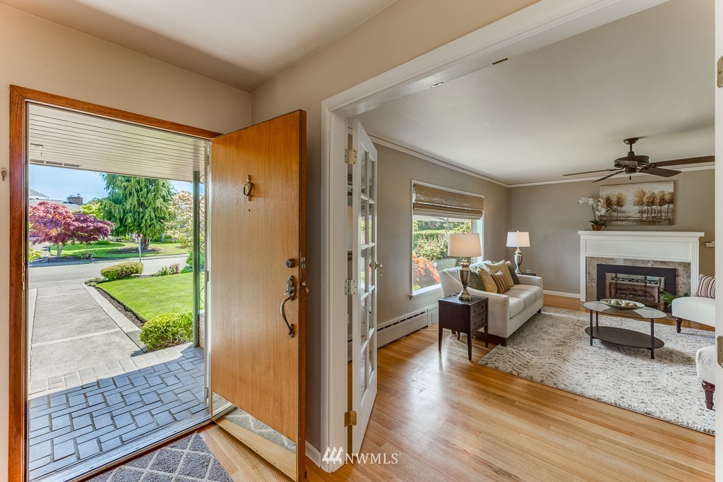 822 Rucker Avenue Everett, WA 98201 - Photo 5 of 40 a living room with furniture and a floor to ceiling window