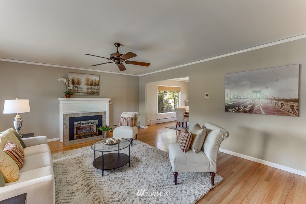 822 Rucker Avenue Everett, WA 98201 - Photo 7 of 40 a living room with furniture and a fireplace