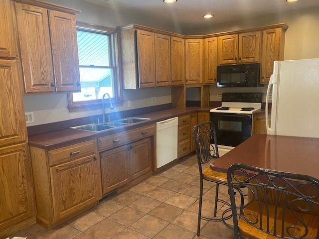 2407 Eastbrook Road New Castle, PA 16105 - Photo 3 of 17 a kitchen with stainless steel appliances a stove a sink and a refrigerator