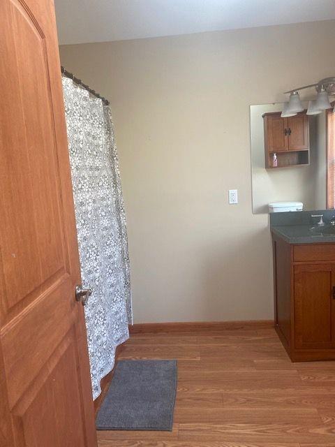 2407 Eastbrook Road New Castle, PA 16105 - Photo 9 of 17 a view of kitchen and hallway with wooden floor
