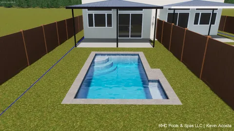 a view of swimming pool with yard