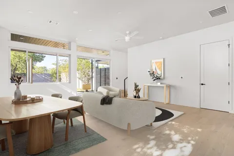 a living room with furniture and a table