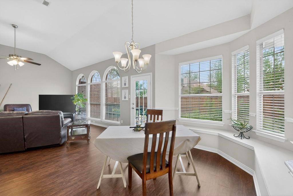236 Hope Circle Murphy, TX 75094 - Photo 12 of 38 Breakfast nook has a huge with seat with a wall of windows and view of the backyard.