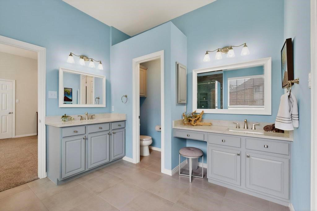 236 Hope Circle Murphy, TX 75094 - Photo 20 of 38 Bathroom with two vanities, a updated walk-in shower with frameless glass