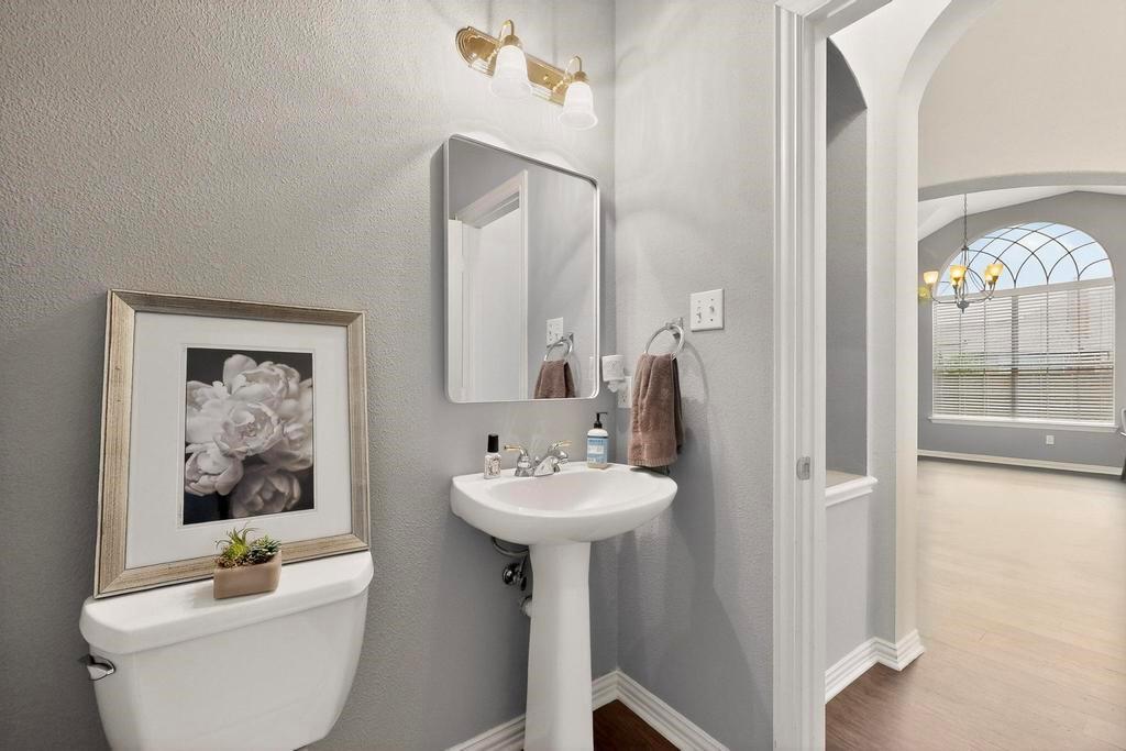 236 Hope Circle Murphy, TX 75094 - Photo 22 of 38 Half bathroom downstairs convenient for guests and has a large storage closet