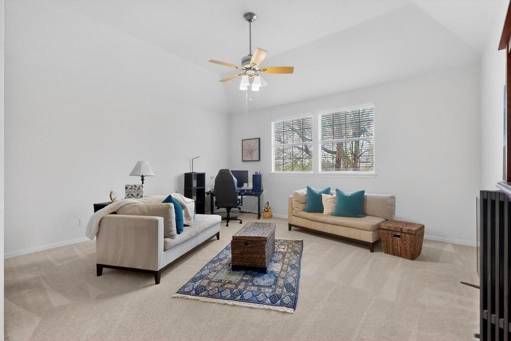 236 Hope Circle Murphy, TX 75094 - Photo 23 of 38 Living area great for a media or game room featuring ceiling fan, and vaulted ceiling