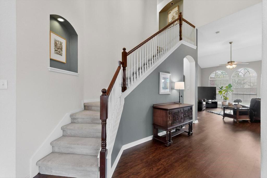 236 Hope Circle Murphy, TX 75094 - Photo 3 of 38 Stairway overlooks formals with wood LVP floors, high ceilings and arched walkways