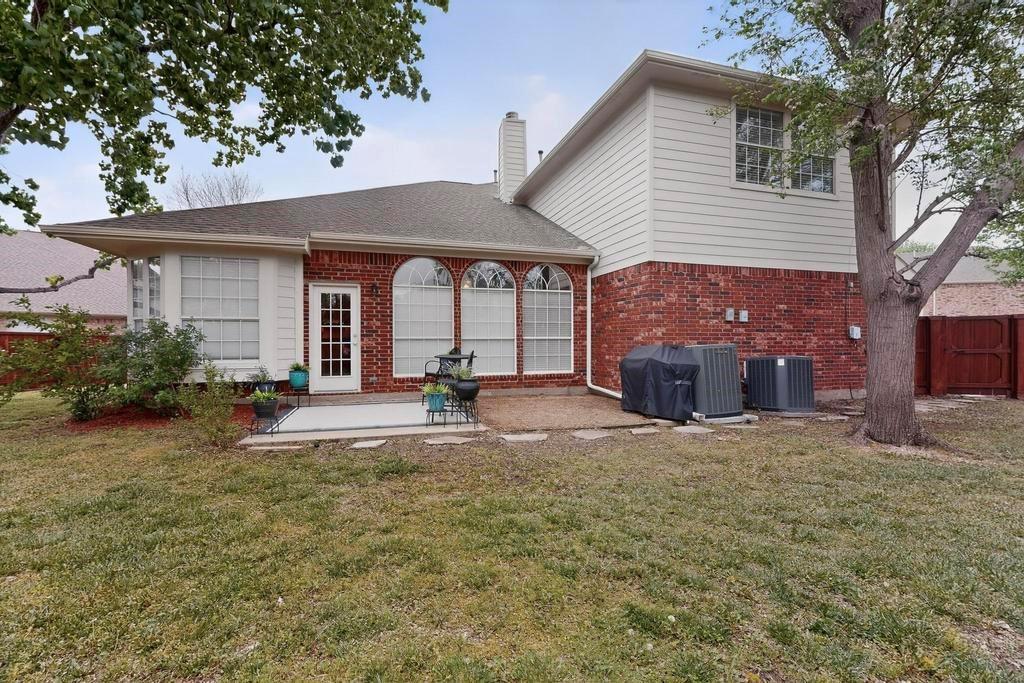 236 Hope Circle Murphy, TX 75094 - Photo 32 of 38 Back of property with lovely patio area overlooking the large yard