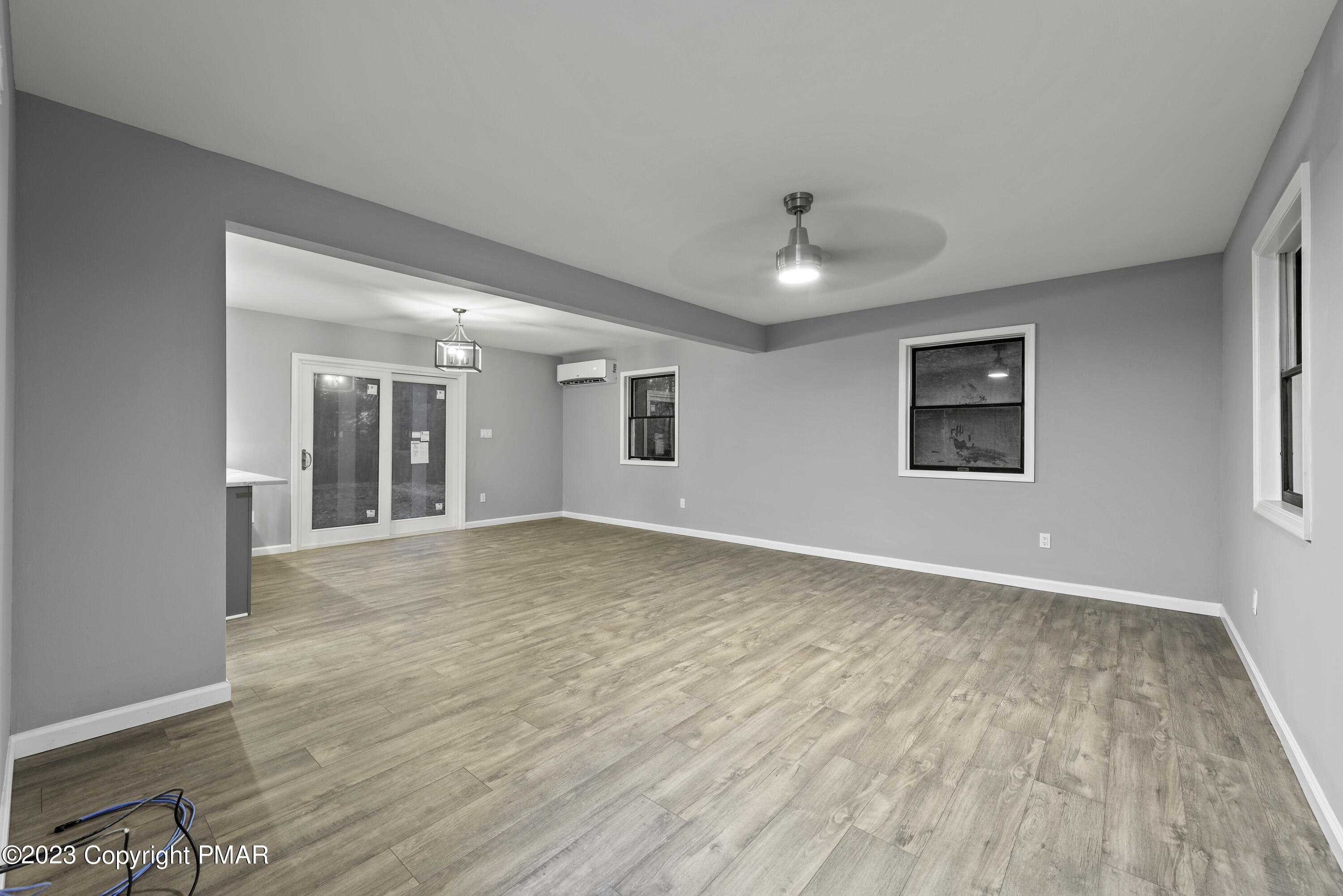 152 Turkey Ridge Kunkletown, PA 18058 - Photo 4 of 35 a view of an empty room with window and wooden floor