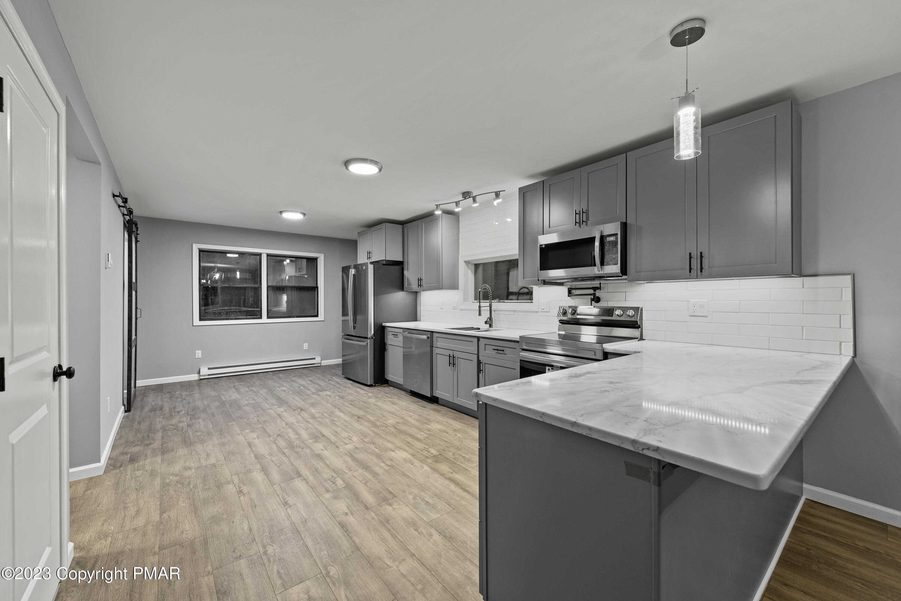 152 Turkey Ridge Kunkletown, PA 18058 - Photo 9 of 35 a kitchen with white cabinets and stainless steel appliances