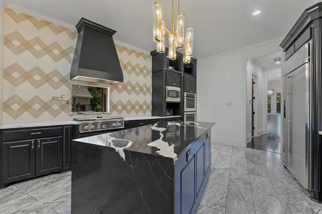 a kitchen with a sink stove and refrigerator