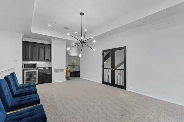 an aerial view of a house with a garden and swimming pool