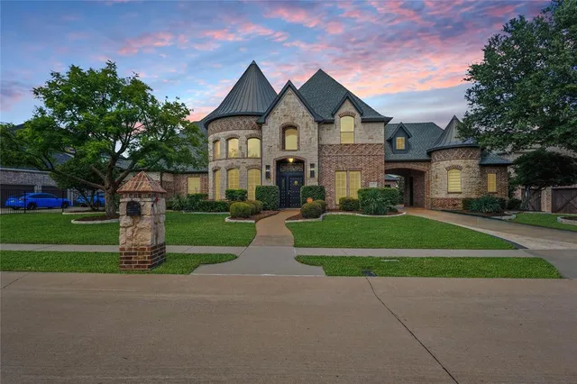 an aerial view of a house with outdoor space and street view