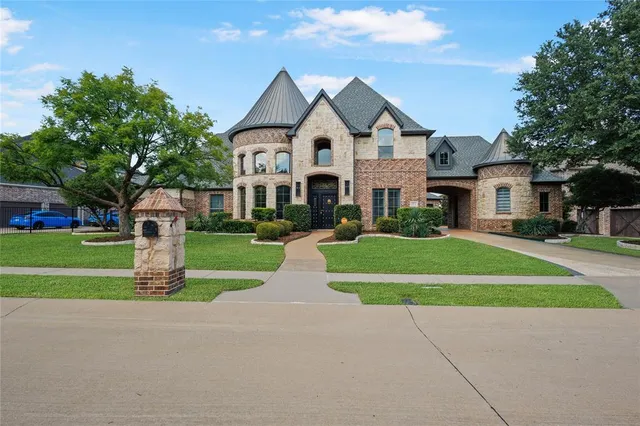 a front view of a house with swimming pool having outdoor seating