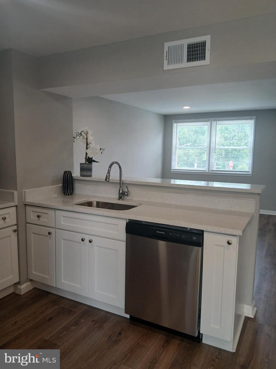 2908 Mallview Road Baltimore, MD 21230 - Photo 5 of 17 Stainless steel sink in coriander counter tops