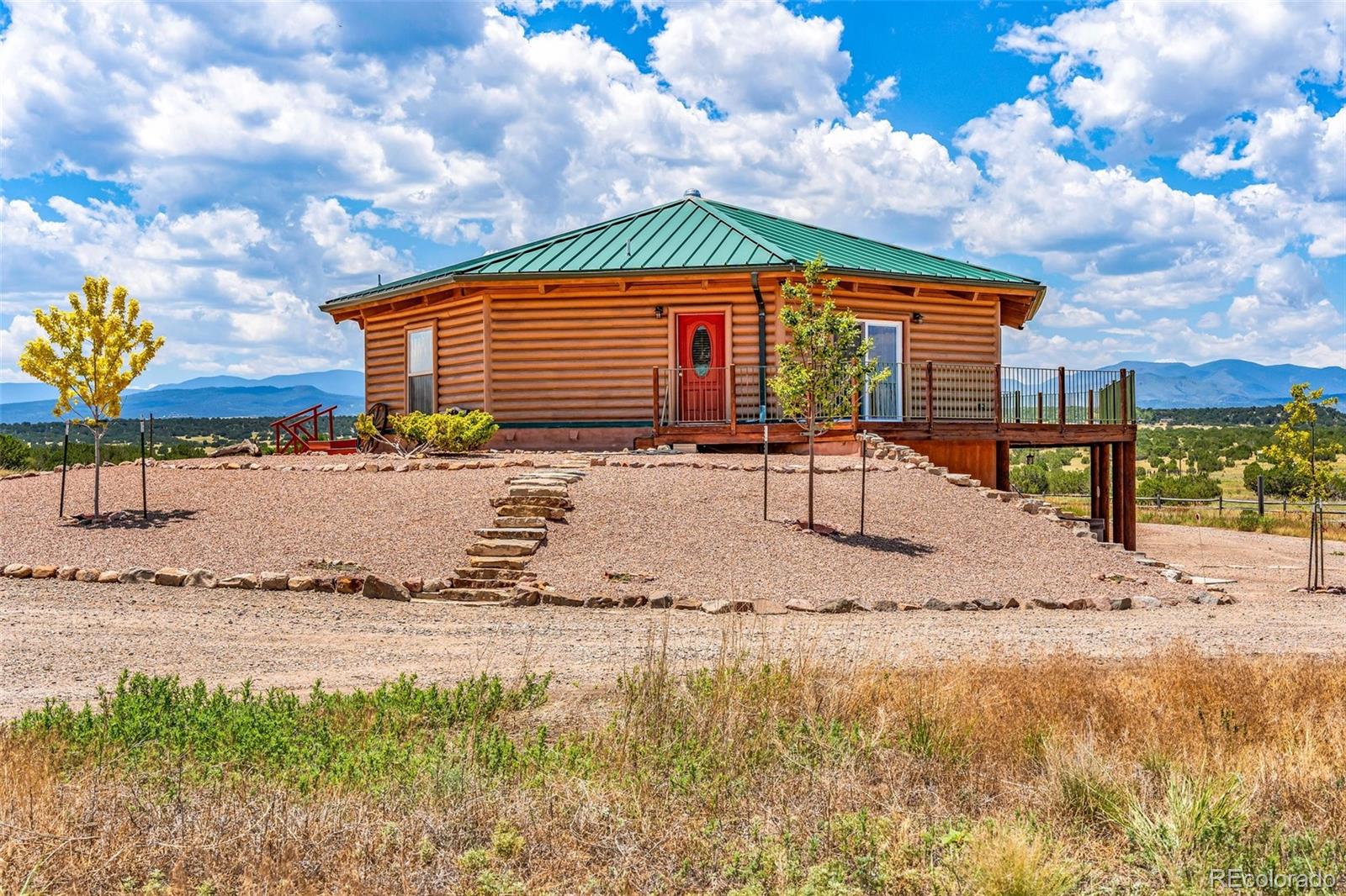 1747 Newton Road Pueblo, CO 81005 - Photo 2 of 40 a backyard of a house with a yard and outdoor seating