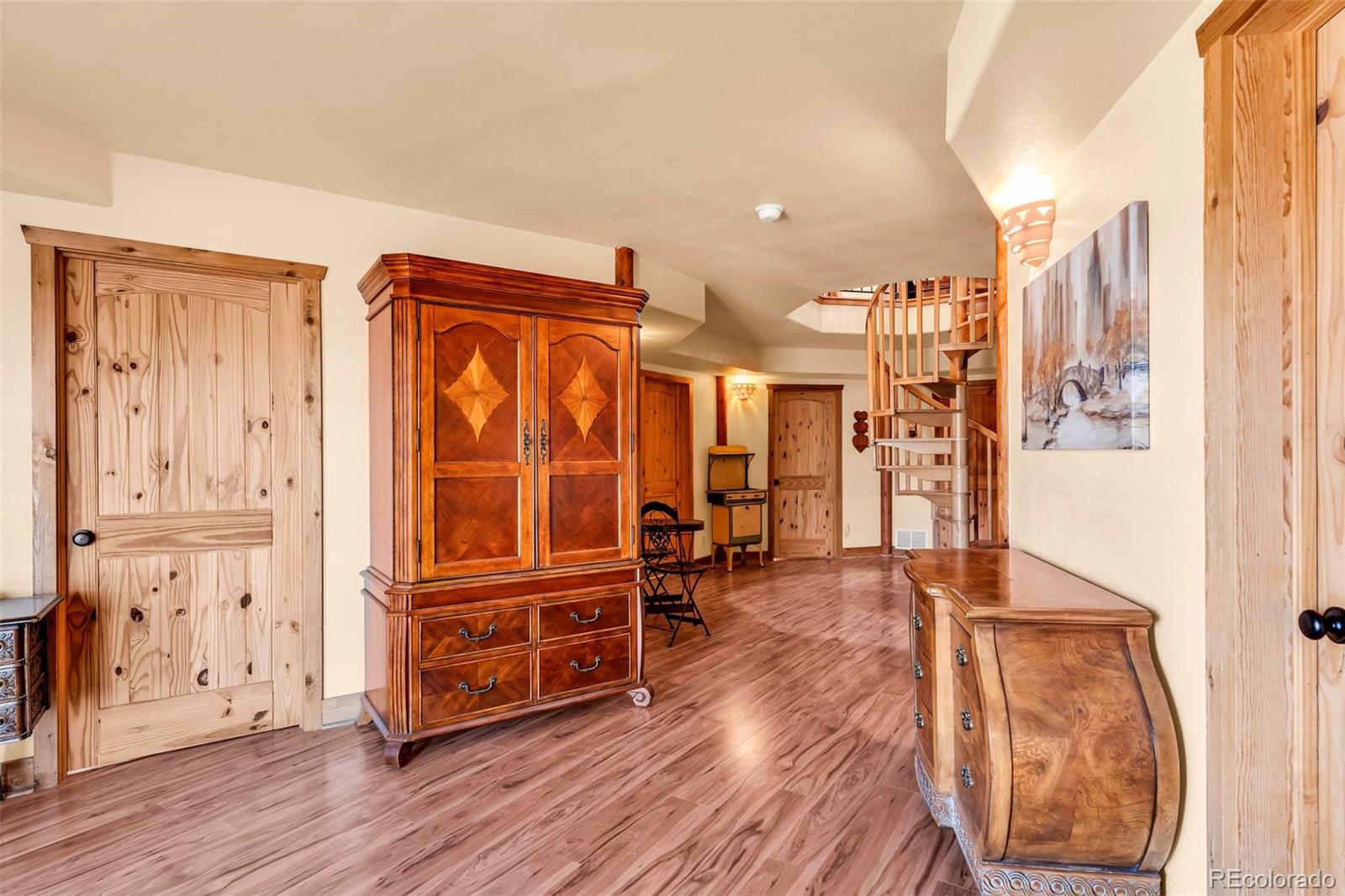 1747 Newton Road Pueblo, CO 81005 - Photo 25 of 40 a view of a living room with furniture and wooden floor