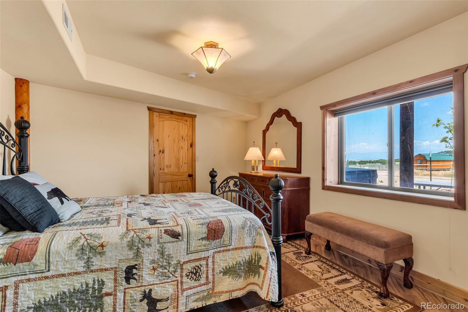 1747 Newton Road Pueblo, CO 81005 - Photo 27 of 40 a bedroom with bed and a window