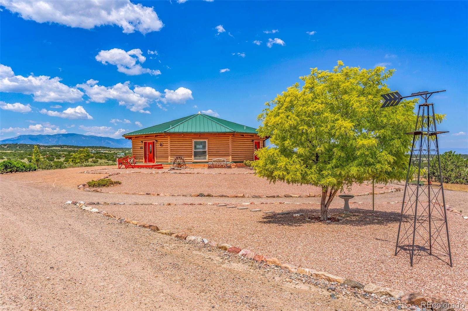 1747 Newton Road Pueblo, CO 81005 - Photo 4 of 40 a house with a tree in the background