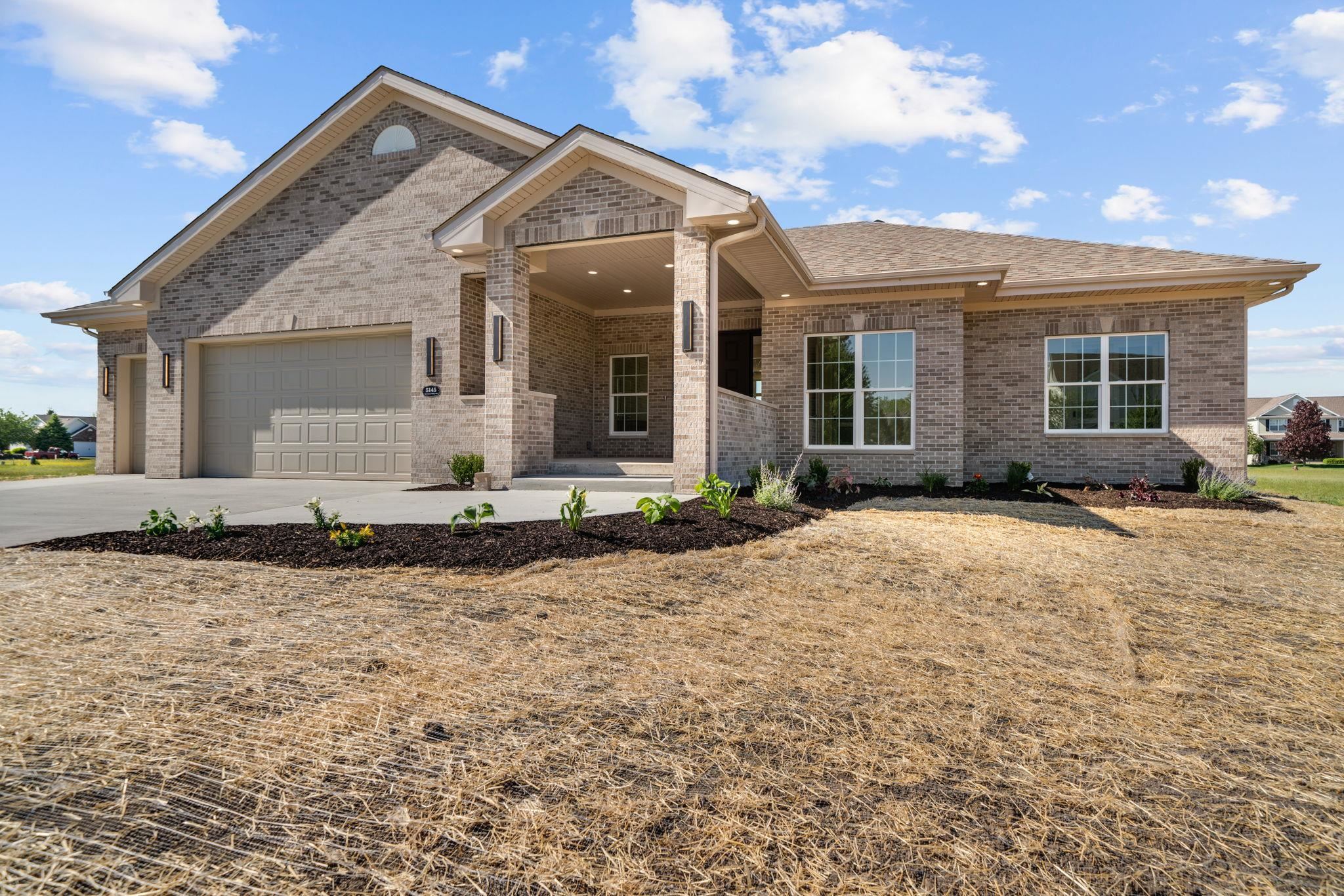 5145 Sycamore Ridge Road Belvidere, IL 61008 - Photo 52 of 57 a front view of a house with a yard and outdoor seating