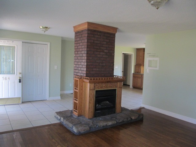 584 Oak Grove Road Goodspring, TN 38460 - Photo 2 of 12 a living room with furniture and a fireplace
