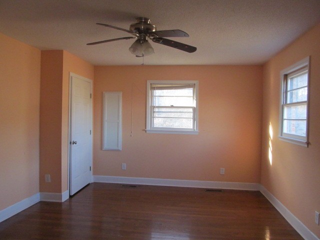 584 Oak Grove Road Goodspring, TN 38460 - Photo 4 of 12 a view of an empty room with wooden floor and a window