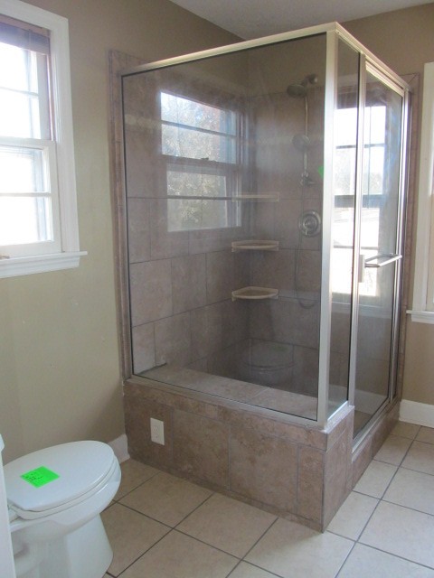 584 Oak Grove Road Goodspring, TN 38460 - Photo 6 of 12 a bathroom with a shower and a toilet