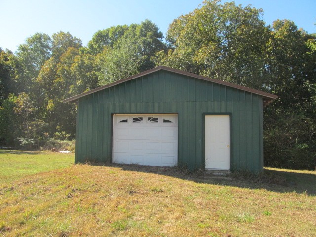 584 Oak Grove Road Goodspring, TN 38460 - Photo 10 of 12 a view of a house with backyard and trees