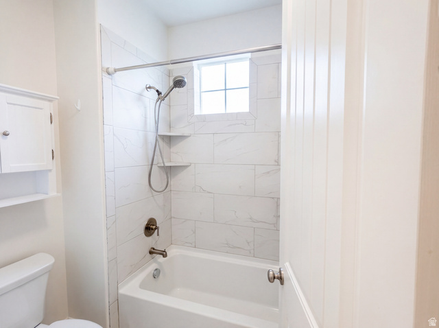 1251 North 2525 West Clinton, UT 84015 - Photo 20 of 30 Shower-over-tub combination with white subway tile surround, integrated corner shelves, and a window for natural light